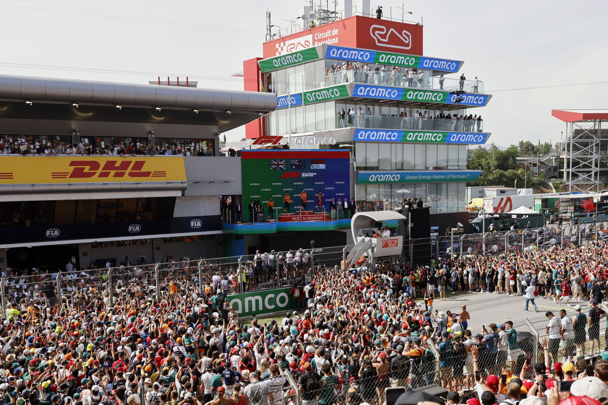 McLaren driver Oscar Piastri of Australia, center, celebrates on the podium with McLaren driver Lando Norris of Britain, and Ferrari driver Charles Leclerc of Monaco after winning the Spanish Grand Prix Formula One race at the Barcelona Catalunya racetrack in Montmelo, near Barcelona, Spain, Sunday, June 1, 2025. (AP Photo/Joan Monfort)