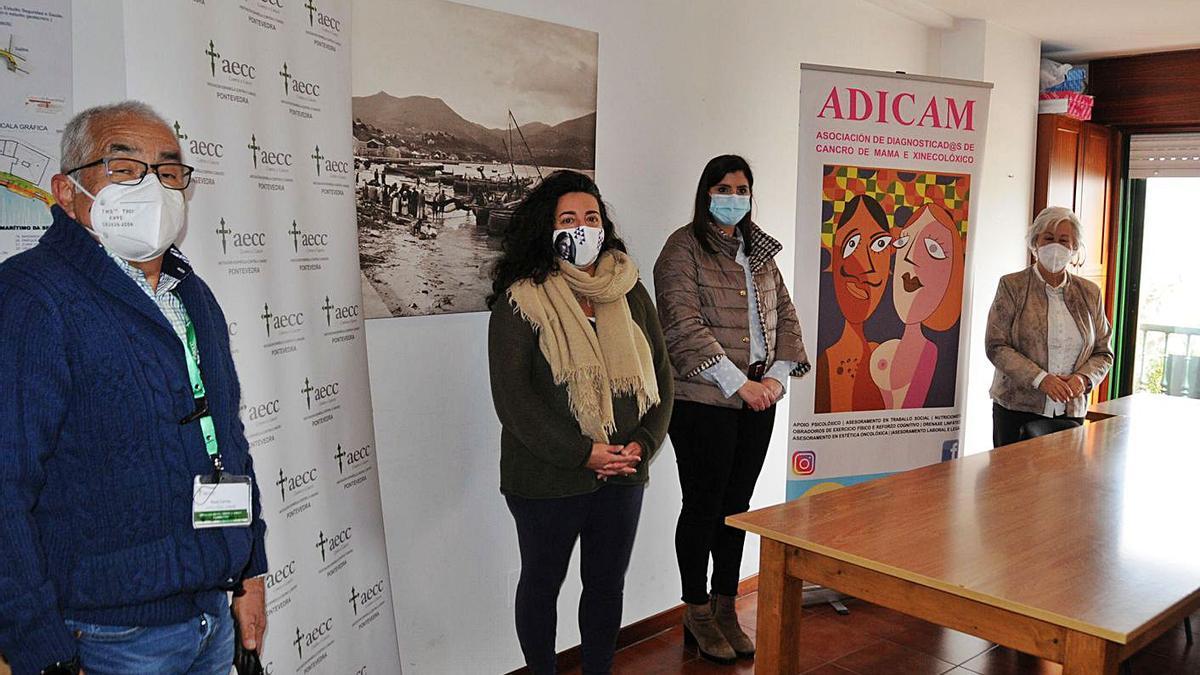 Representantes de la AECC y de Adicam, junto a María Ortega y Leticia Santos en la nueva sede.   | // G.N.