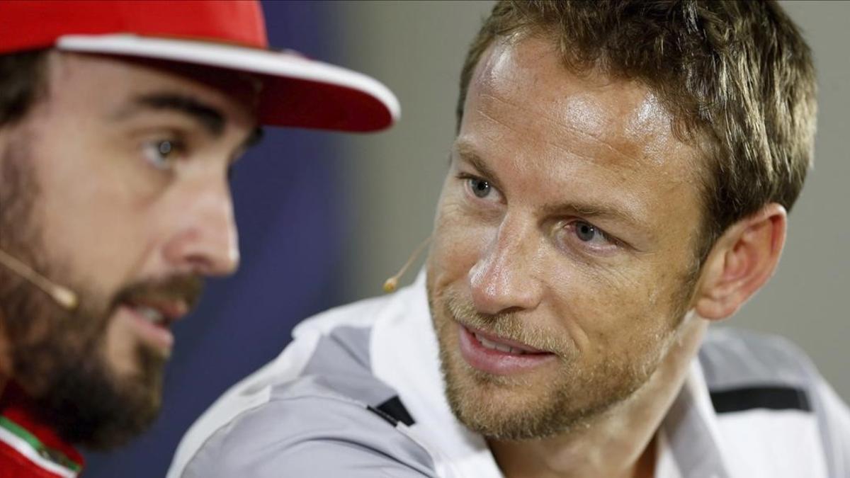 Fernando Alonso y Jenson Button, en Abu Dabi.