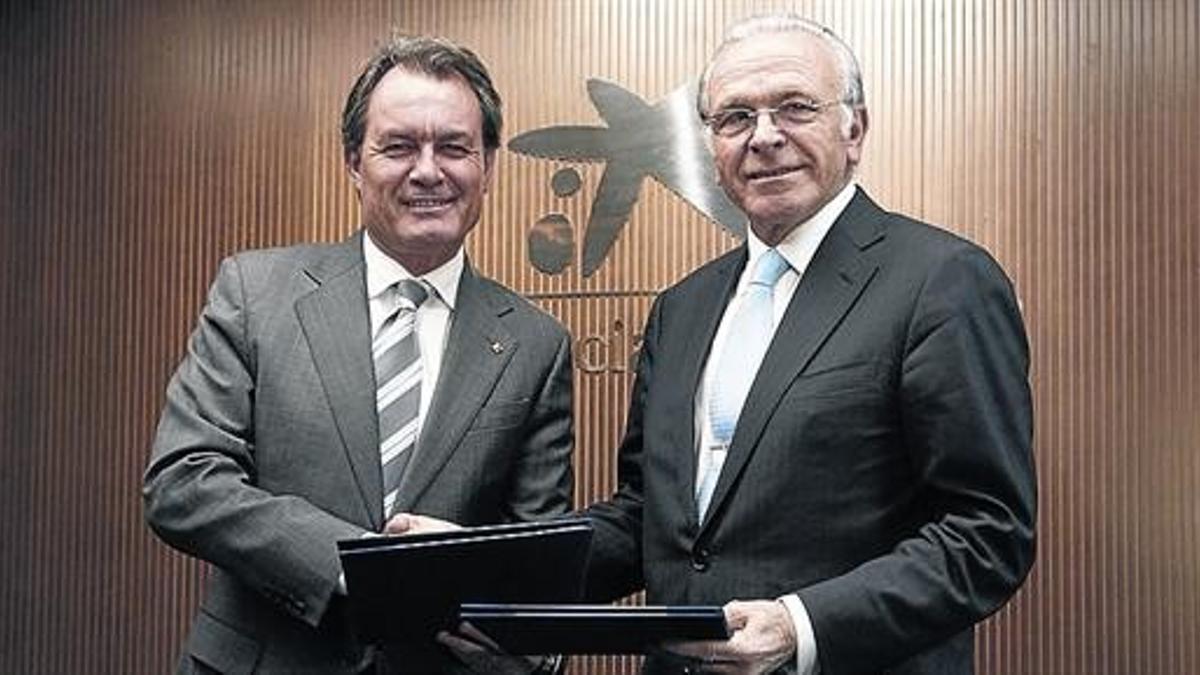 Artur Mas e Isidre Fainé, ayer, en la sede de La Caixa en Barcelona.