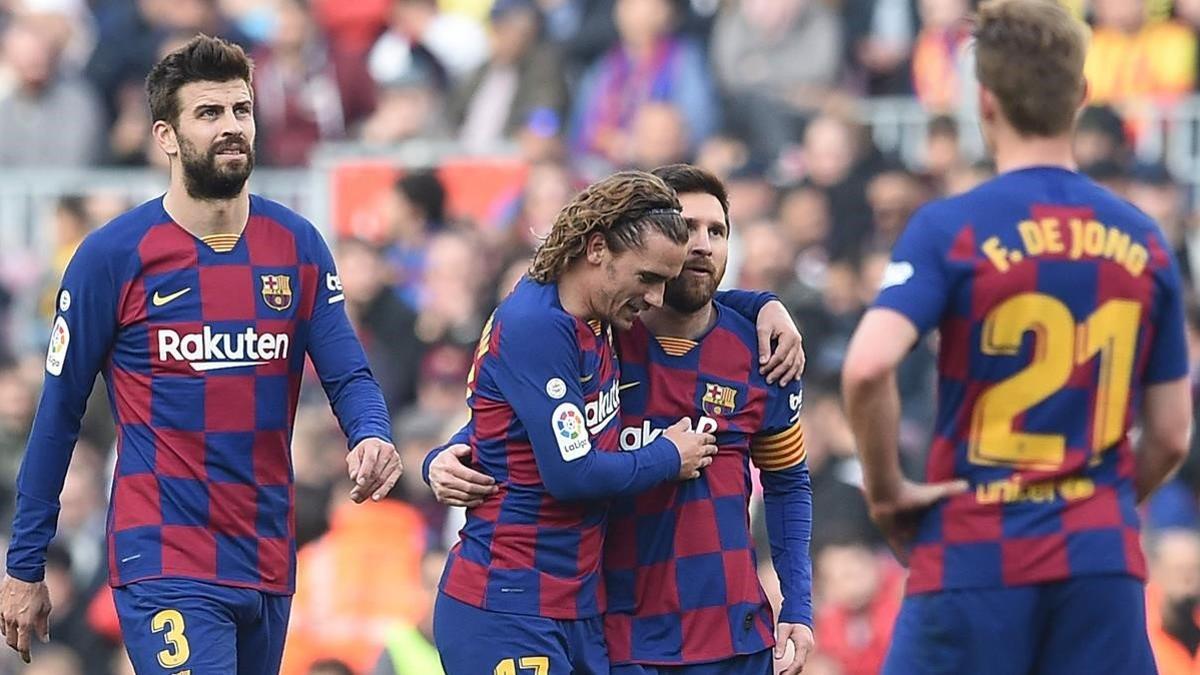 Griezmann celebra con Messi su gol ante el Getafe.