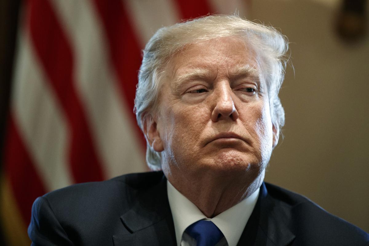 FILE - In this Tuesday, Jan. 9, 2018 file photo, President Donald Trump listens during a meeting with lawmakers on immigration policy in the Cabinet Room of the White House in Washington. Trump’s use of a vulgar term to describe African countries has left the small cluster of immigration hard-line groups in the U.S. scrambling to distance themselves from him. Trump used the vulgarity during an Oval Office meeting on Thursday, Jan. 11, with members of Congress in asking why the U.S. would want more immigrants from places such as Haiti and Africa. (AP Photo/Evan Vucci, File)