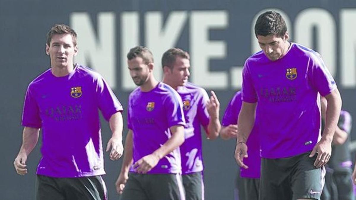 Messi y Luis Suárez, en el entrenamiento de ayer del Barça en la ciudad deportiva de Sant Joan Despí.