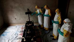  A healthcare worker sprays a room during a funeral of  a person who is suspected of dying of Ebola in Beni  North Kivu Province of Democratic Republic of Congo  REUTERS Goran Tomasevic File Photo