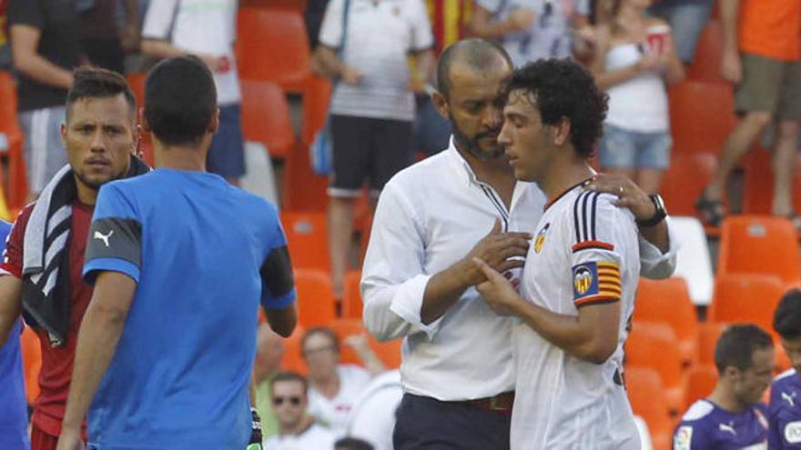 Nuno y Parejo, charlan tras un partido