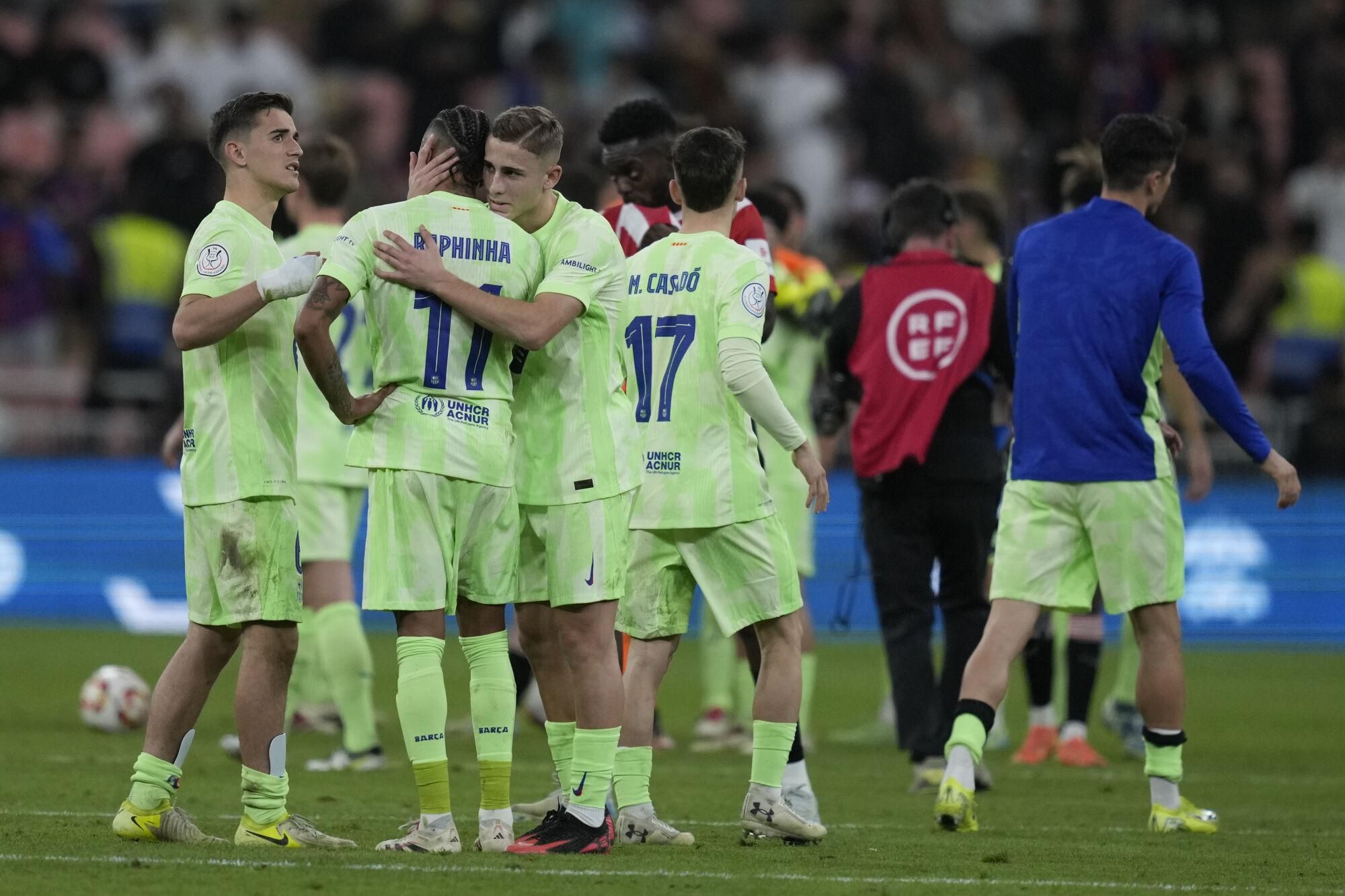 Barcelona players celebrate after the Spanish Super Cup semifinal match between Athletic Bilbao and Barcelona in Jeddah, Saudi Arabia, on Wednesday, Jan. 8, 2025. (AP Photo/Altaf Qadri)