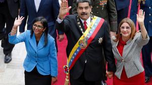 FILE - Venezuelas President Nicolas Maduro, then Constituent National Assembly President Delcy Rodriguez, left, and first lady Cilia Flores, wave as they arrive to the National Assembly, in Caracas, Venezuela, May 24, 2018. (AP Photo/Ariana Cubillos, File)