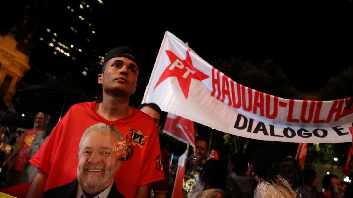 A supporter of presidential candidate Fernando Haddad wearing a t-shirt of Brazilian former President Luiz Inacio Lula da Silva, attends a campaign rally in Rio de Janeiro