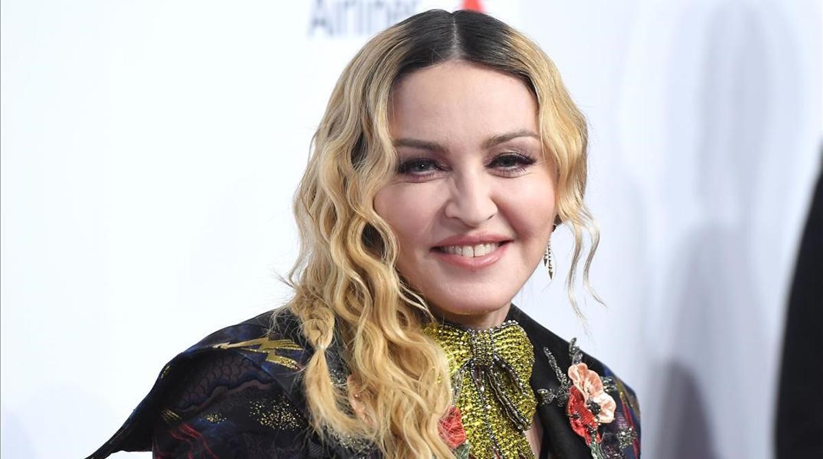 (FILES) In this file photo taken on December 9  2016 Madonna attends the Billboard Women in Music 2016 event in New York City  - Superstar singer Madonna has been censored on Instagram for spreading false information about a supposed cure for COVID-19 after she shared clips from a video also re-tweeted by Donald Trump  (Photo by ANGELA WEISS   AFP)