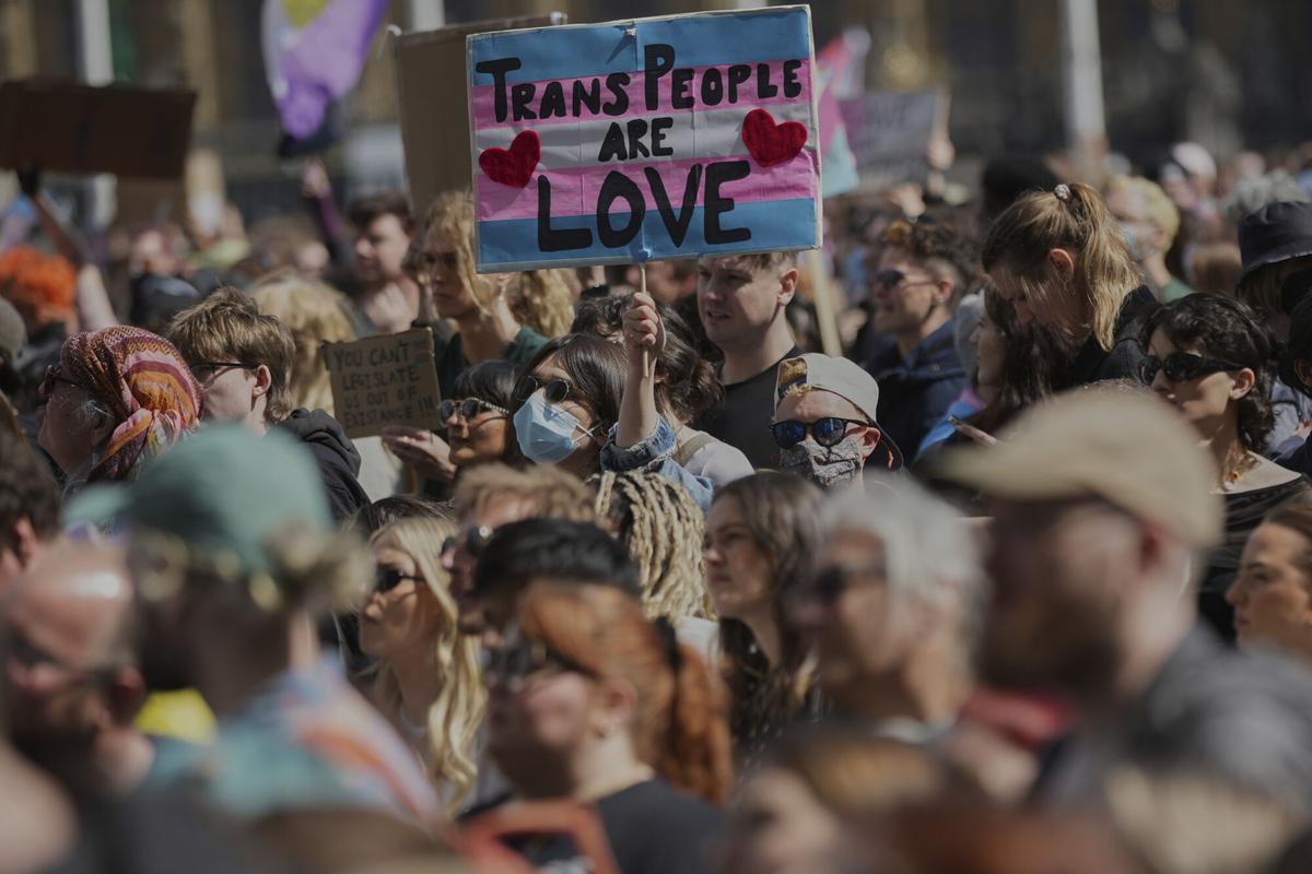 Campaigners take part in a rally organised by trans rights groups, trade unions, and community organisations following the Supreme Court ruling on the definition of a woman in equalities law, at Parliament Square, central London, Saturday April 19, 2025. (AP Photo/Alastair Grant)