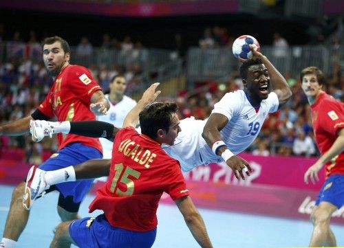 France's Luc Abalo takes a shot in his men's handball quarterfinals match against Spain at the Basketball Arena during the London 2012 Olympic Games