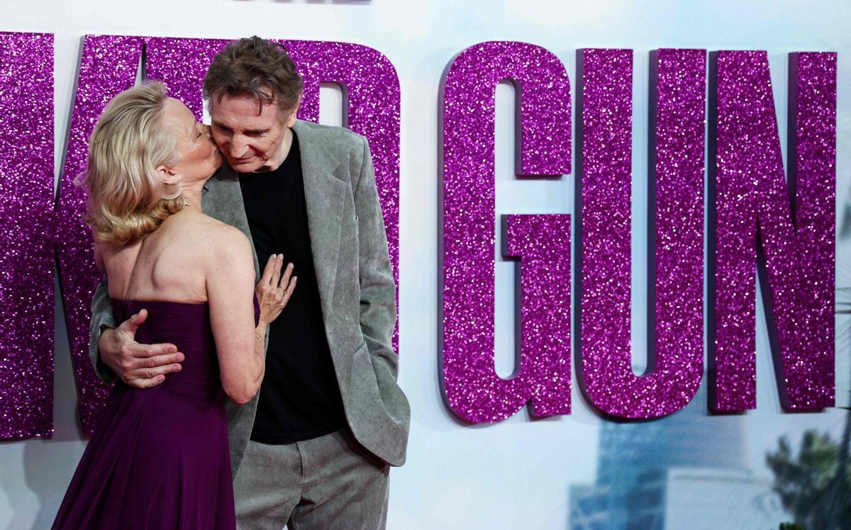 US actress Pamela Anderson (L) and British actor Liam Neeson (R) pose on the red carpet upon arrival for the UK Premier of "Naked Gun" in Leicester Square, central London, on July 22, 2025. (Photo by Adrian DENNIS / AFP)