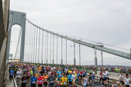 Runners cross the Verrazano-Narrows Bridge shortly after the start of the New York City Marathon in New York