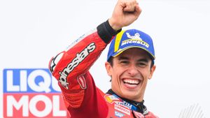 Winner Marc Marquez from Spain from the Ducati Lenovo Team celebrates on the podium following the MotoGP race, German Grand Prix, at the Sachsenring circuit, in Hohenstein-Ernstthal, Germany, Sunday July 13, 2025. (Robert Michael/dpa via AP). GERMANY OUT; MANDATORY CREDIT