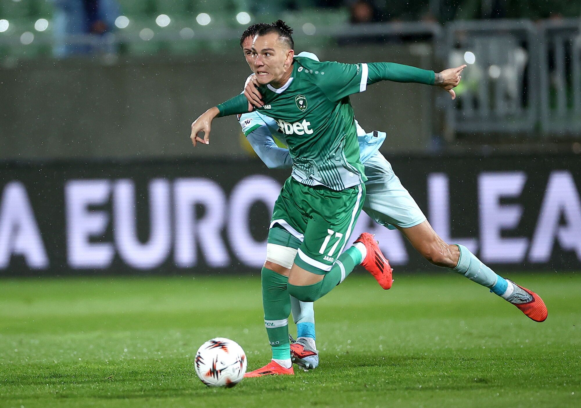 RAZGRAD (Bulgaria), 02/10/2025.- Son (front) of Ludogorets in action against Sergi Altimira of Betis during the UEFA Europa League league phase match between PFC Ludogorets Razgrad and Real Betis Balompie, in Razgrad, Bulgaria, 02 October 2025. EFE/EPA/BORISLAV TROSHEV