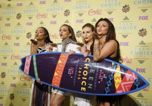 The group Little Mix poses backstage with their award for Choice Music: Breakout Artist at the 2015 Teen Choice Awards in Los Angeles