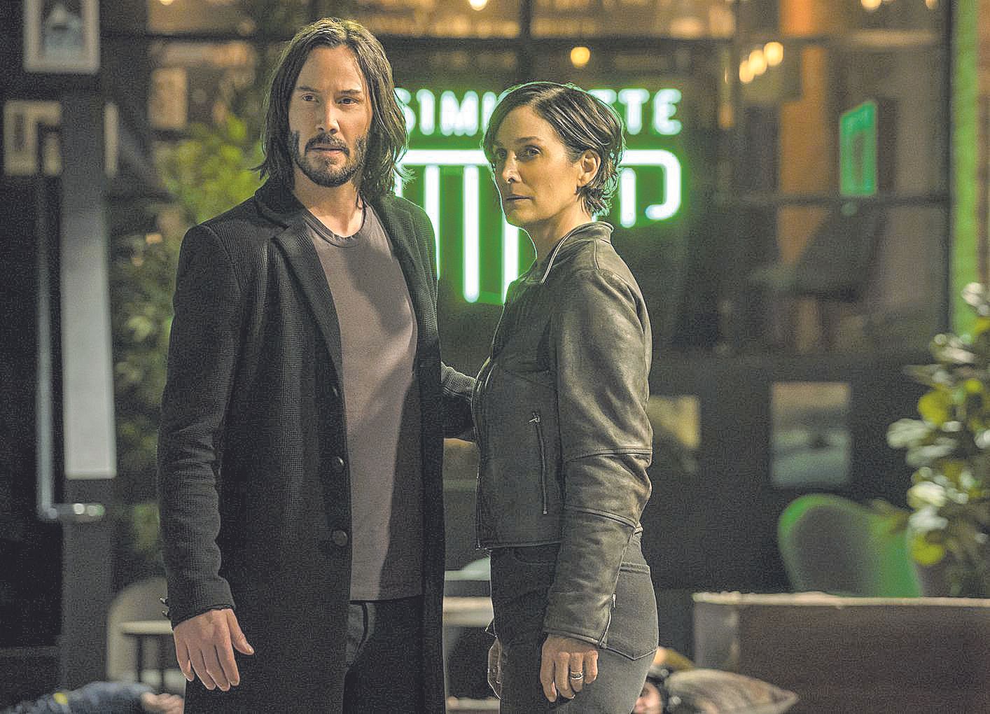 Keanu Reeves y Carrie-Anne Moss, intérpretes de la primera trilogía, en ‘Matrix Resurrections’.