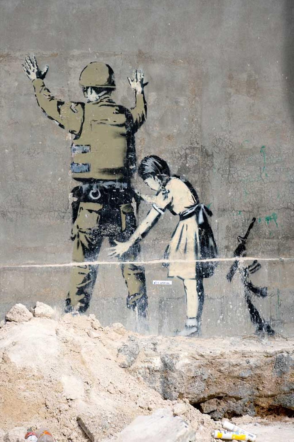Grafitti de Banksy en el muro que separa Israel de Palestina.