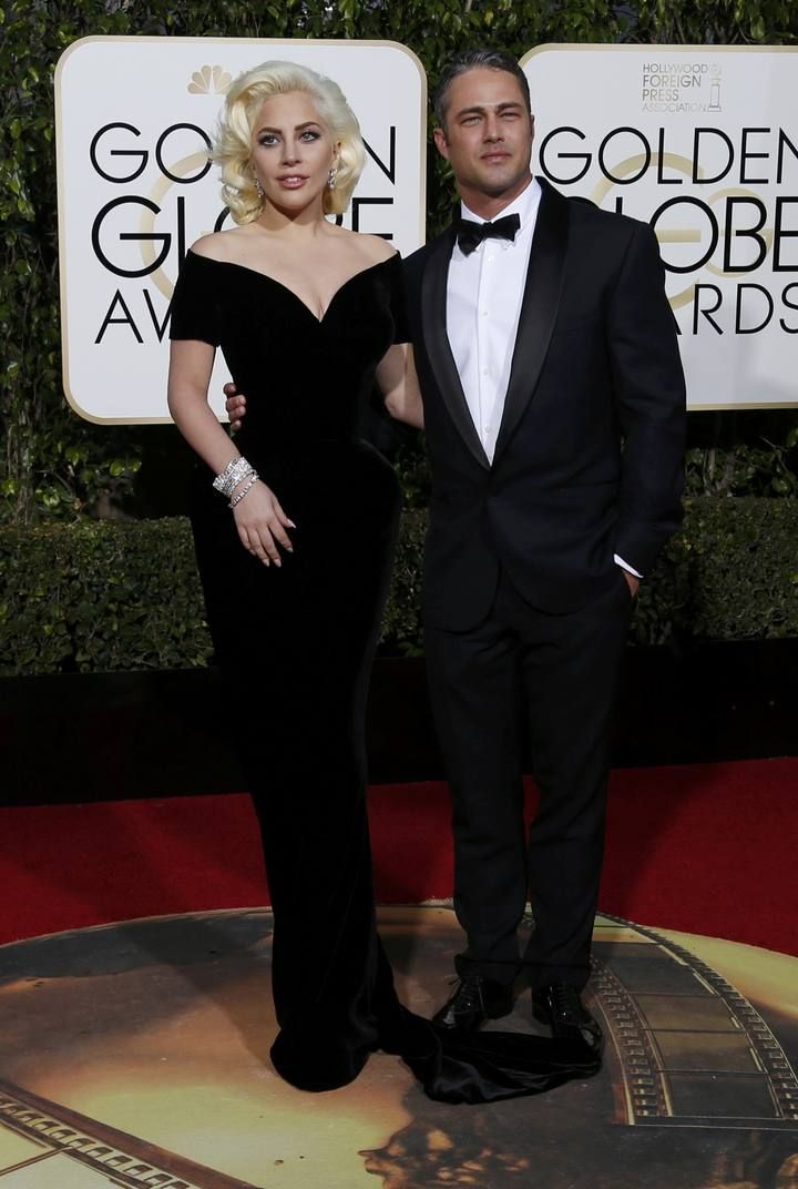 Singer Lady Gaga arrives with finance Taylor Kinney at the 73rd Golden Globe Awards in Beverly Hills