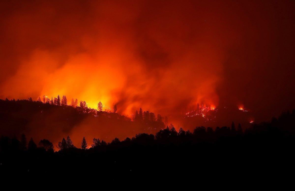 OROVILLE  CA - NOVEMBER 11  The Camp Fire burns in the hills on November 11  2018 near Oroville  California  Fueled by high winds and low humidity the Camp Fire ripped through the town of Paradise charring over 105 000 acres  killed 23 people and has destroyed over 6 700 homes and businesses  The fire is currently at 25 percent containment    Justin Sullivan Getty Images AFP    FOR NEWSPAPERS  INTERNET  TELCOS   TELEVISION USE ONLY