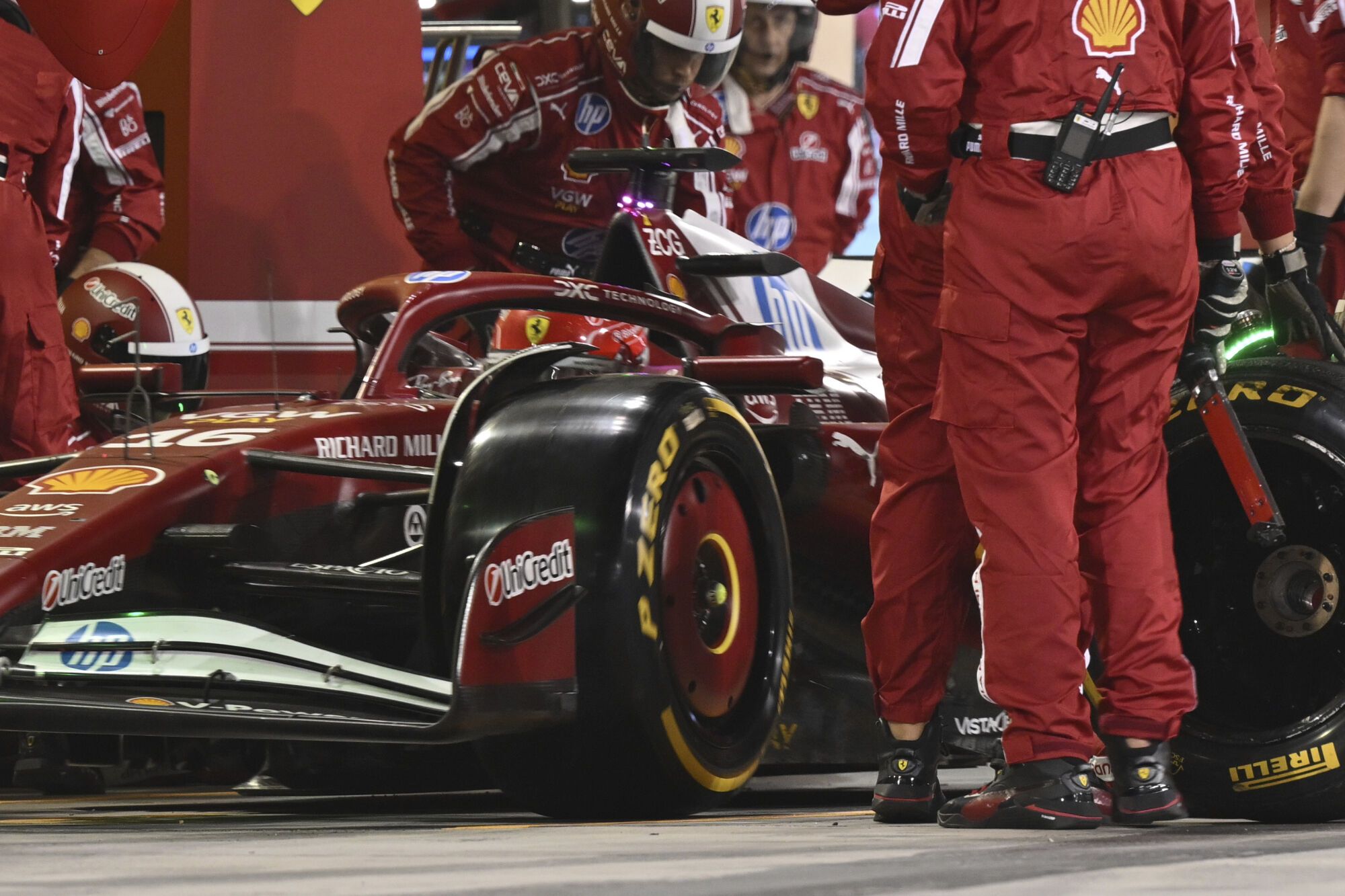 Ferrari driver Charles Leclerc of Monaco makes a pit stop during the Formula One Bahrain Grand Prix at Sakhir circuit, Sunday, April 13, 2025. (Andrej Isakovic Pool via AP). EDITORIAL USE ONLY / ONLY ITALY AND SPAIN