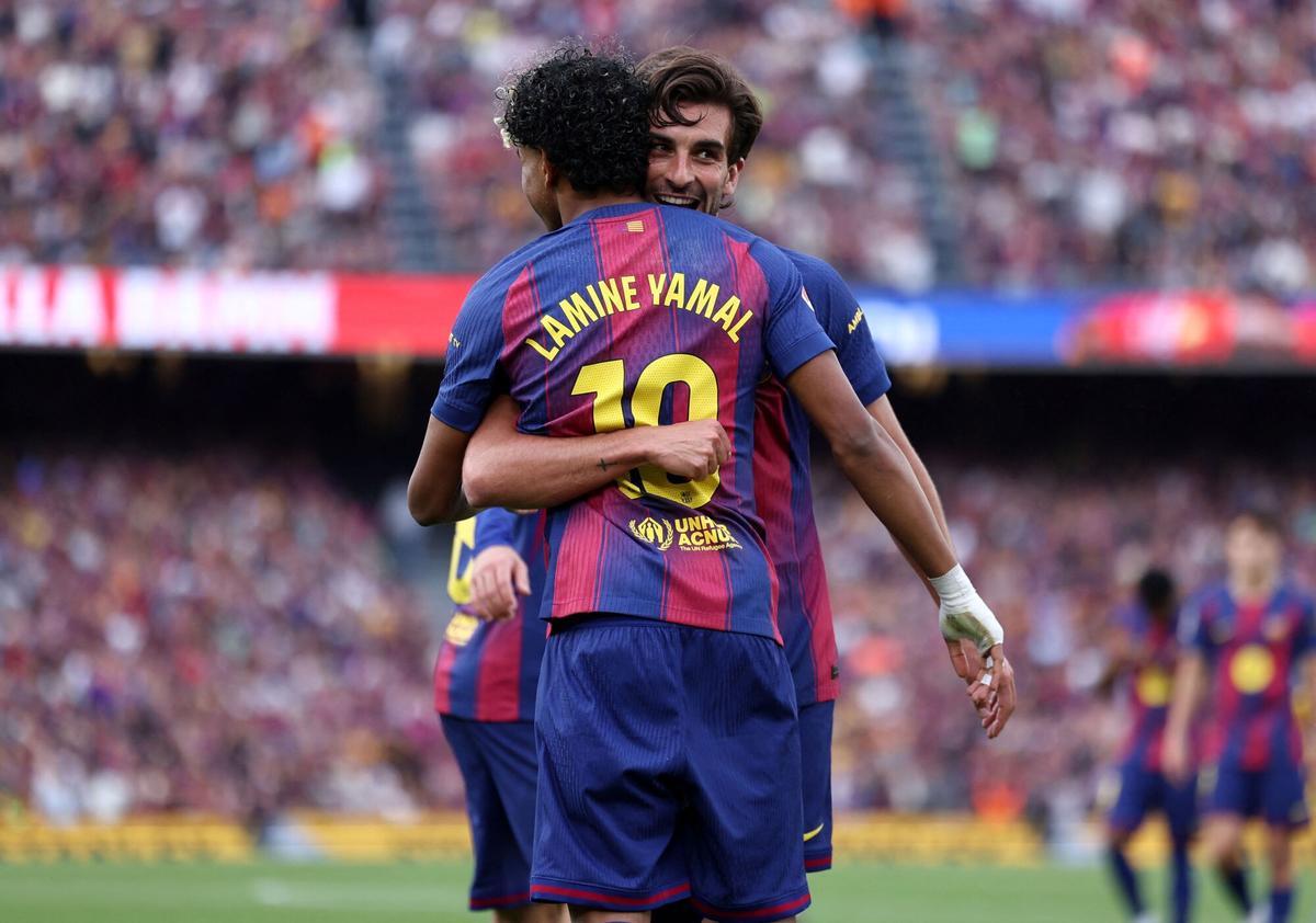 Barcelona's Spanish forward #07 Ferran Torres celebrates with Barcelona's Spanish forward #10 Lamine Yamal scoring his team's second goal during the Spanish league football match between FC Barcelona and RCD Espanyol at the Camp Nou stadium in Barcelona on April 11 , 2026. (Photo by Josep LAGO / AFP)