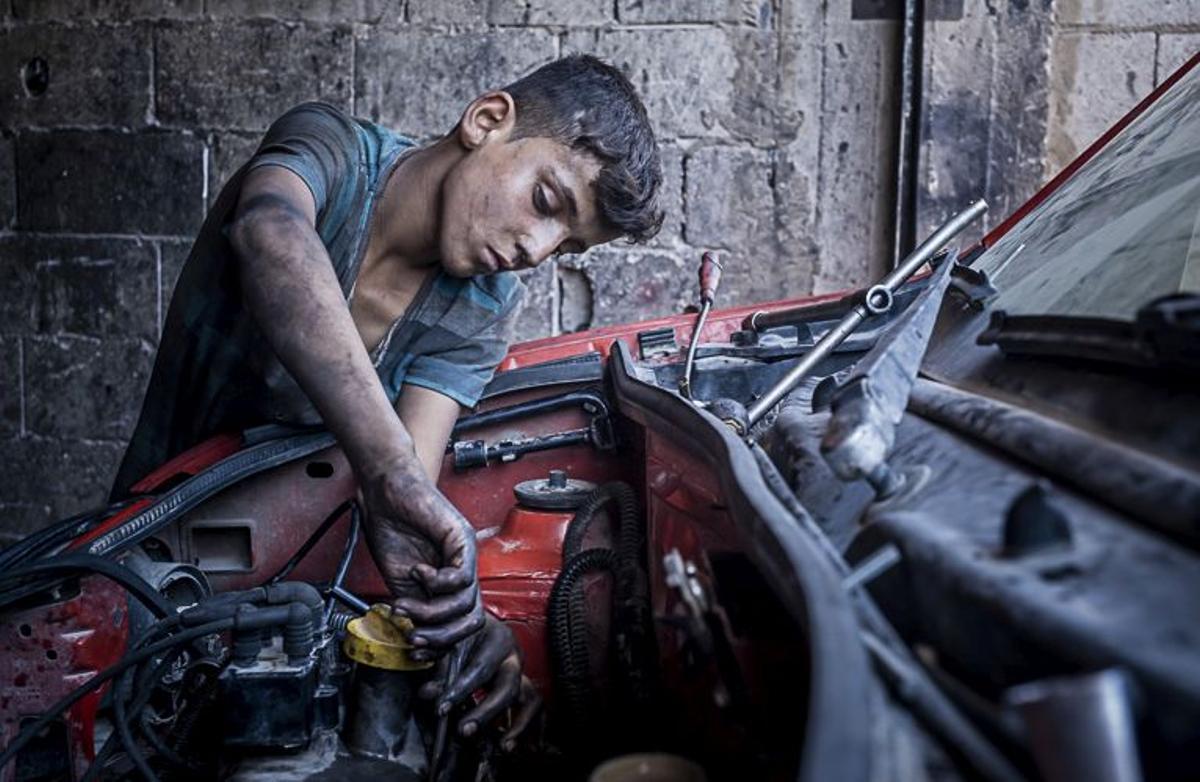 Ahmat 11 years old, car mechanic, child labour, syrian refugee, in Arsal, Bekaa Valley, Lebanon