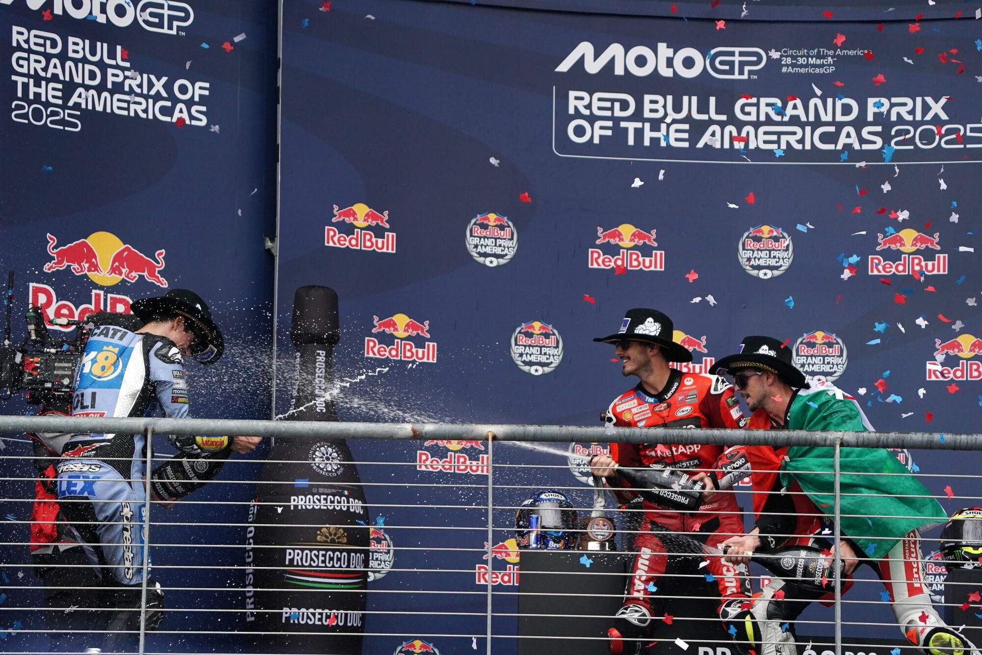 AUSTIN (United States), 30/03/2025.- Winner Francesco Bagnaia (C) of Italy, Ducati Lenovo Team, third placed Fabio Di Giannantonio (R) of Italy, Pertamina Enduro VR46 Racing Team, and second placed Alex Marquez (L) of Spain, BK8 Gresini Racing MotoGP, celebrate on the podium for the MotoGP Race of the Americas in Austin, Texas, USA, 30 March 2025. (Motociclismo, Italia, España) EFE/EPA/DUSTIN SAFRANEK