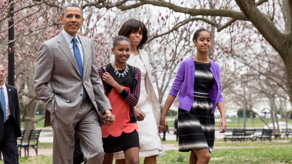 El presidente Obama, junto a su mujer Michelle y sus hijas Sasha (a su lado) y Malia, el pasado día 31.