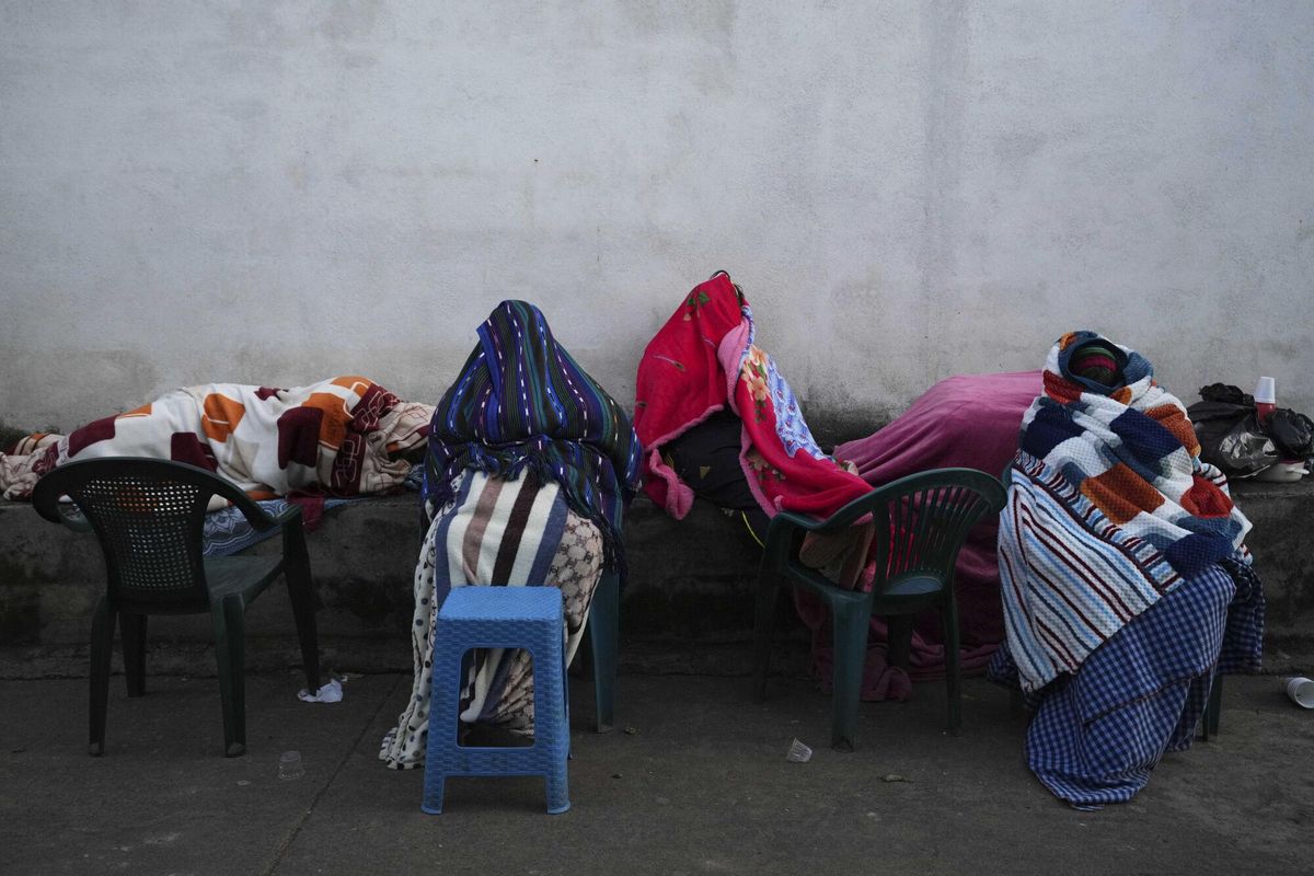 Residents remain outside their homes after dozens of earthquakes and aftershocks were recorded in a matter of hours in Palin, Guatemala, early Wednesday, July 9, 2025. (AP Photo/Moises Castillo). EDITORIAL USE ONLY/ONLY ITALY AND SPAIN