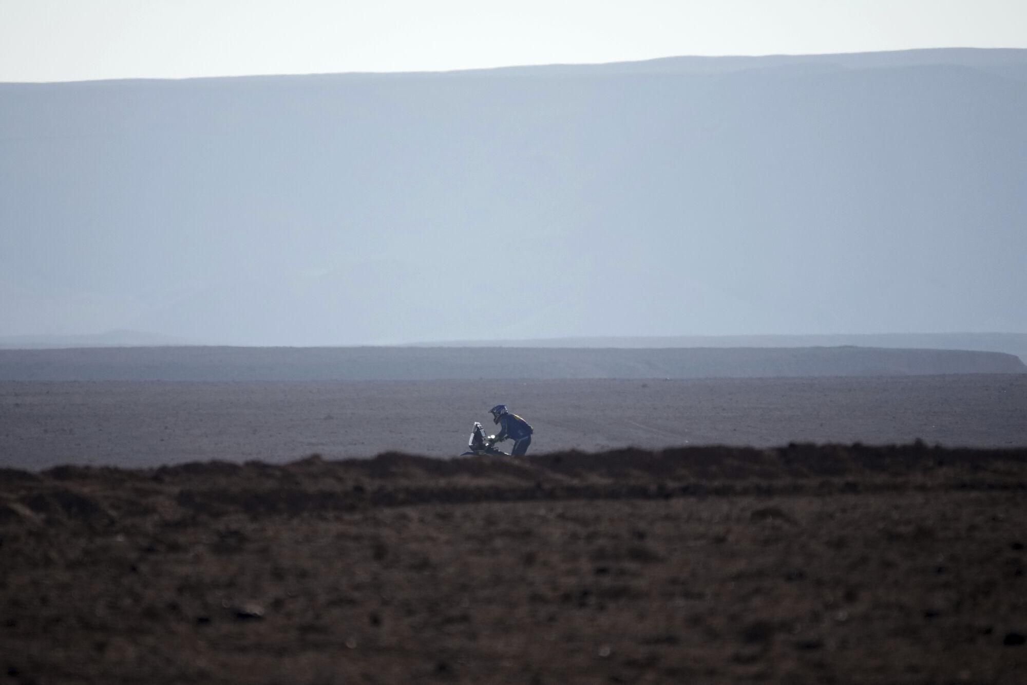 A rider competes during the ninth stage of the Dakar Rally between Riyadh and Haradh, Saudi Arabia, Tuesday, Jan. 14, 2025. (AP Photo/Christophe Ena)