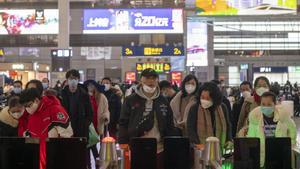 January 27, 2019 - Shanghai, China: Commuters wear face masks in wake of the coronavirus outbreak as they queue at the boarding gate for a high speed train to Nanning, Guangxi Province. Hongqiao Railway Station was unusually quiet as many residents stayed indoors to avoid contracting the virus. The Chinese government took the unprecedented step of quarantining the entire city of Wuhan (population around 11 million) in an effort to stop the spread of the coronavirus beyond the city of its origin. There are fears that the coronavirus may spread through out China and beyond during the Chinese Lunar New Year holidays - the world’s largest annual migration. Chinese citizens were expected to make around 3 billion trips over the 40 day holiday period. (Dave Tacon/Polaris)