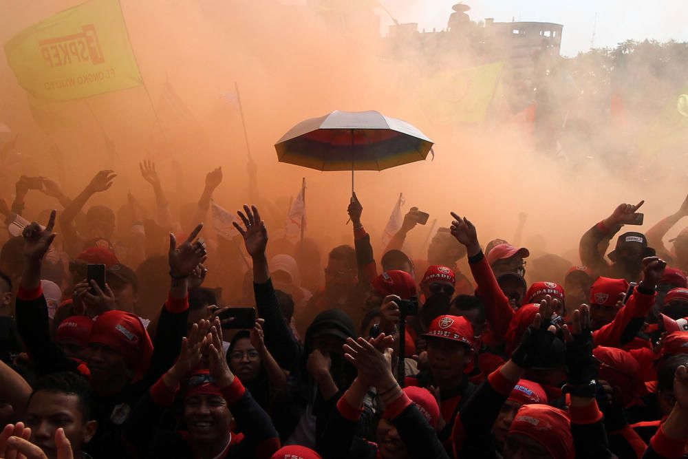 Workers protest during a May Day rally in ...