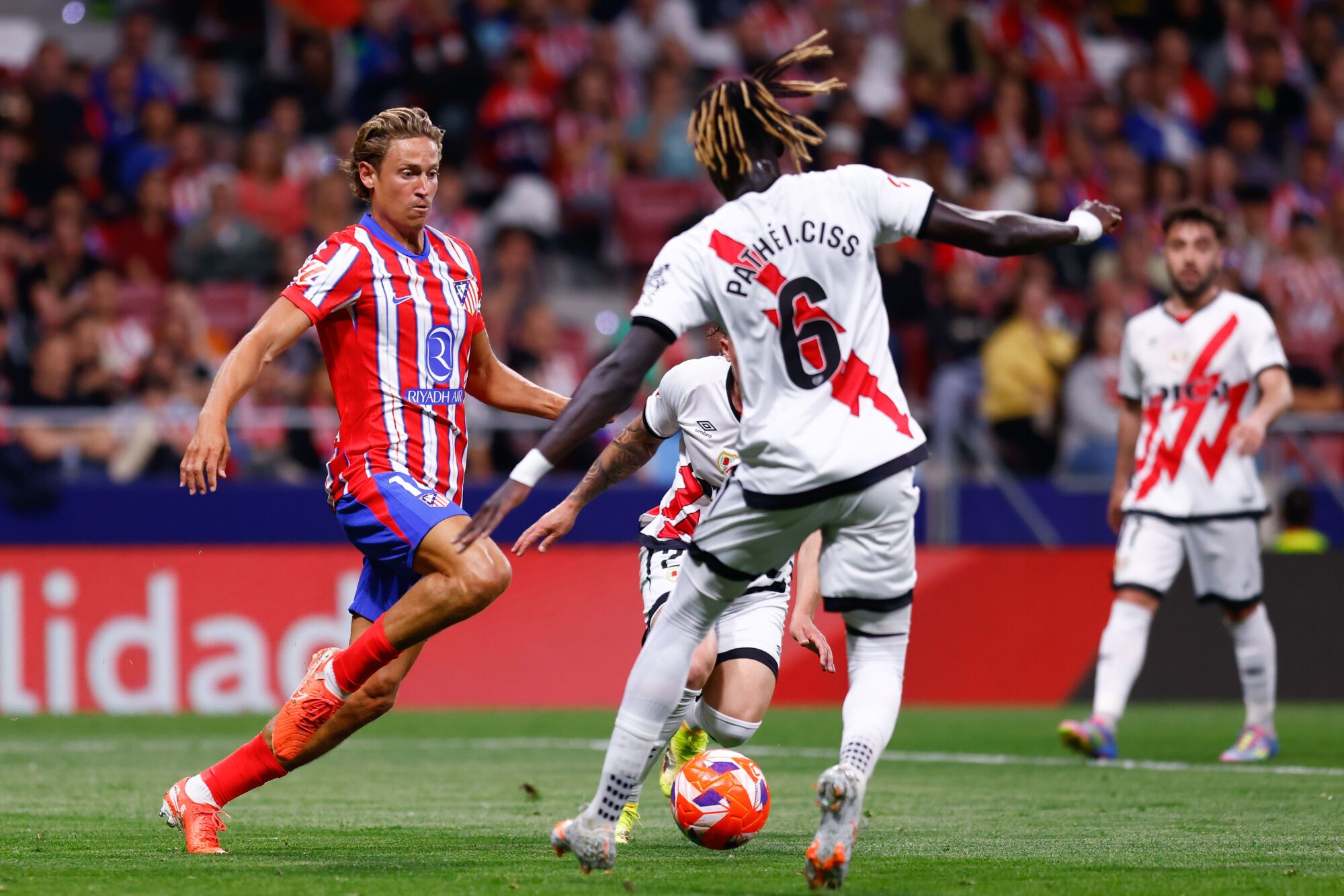 Marcos Llorente of Atletico de Madrid and Pathe Ciss of Rayo Vallecano in action during the Spanish League, LaLiga EA Sports, football match played between Atletico de Madrid and Rayo Vallecano at Riyadh Air Metropolitano stadium on April 24, 2025, in Madrid, Spain. AFP7 24/04/2025 ONLY FOR USE IN SPAIN. Dennis Agyeman / AFP7 / Europa Press;2025;SPAIN;SPORT;ZSPORT;SOCCER;ZSOCCER;Atletico de Madrid v Rayo Vallecano - LaLiga EA Sports;