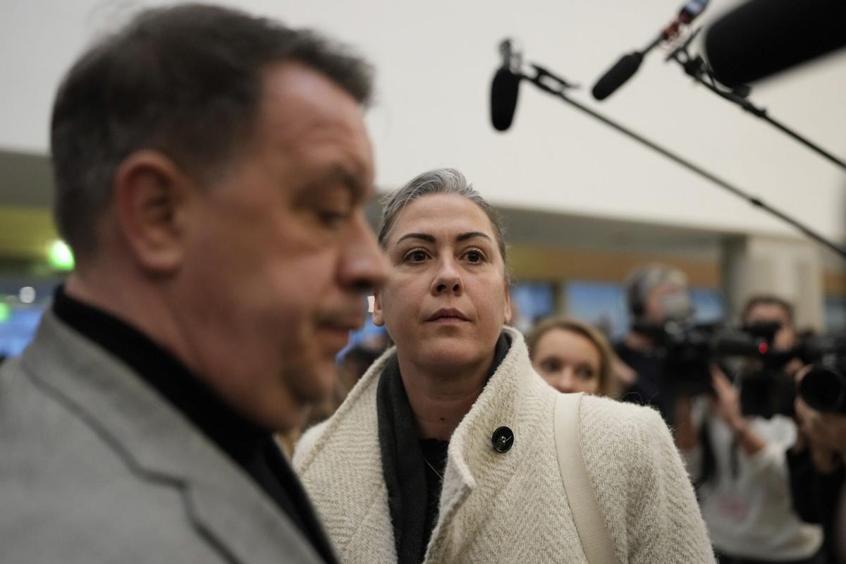 The daughter of Gisele Pelicot, Caroline Darian, center, and her son David, left, arrive in the Avignon courthouse, southern France, Thursday, Dec. 19, 2024. (AP Photo/Lewis Joly)