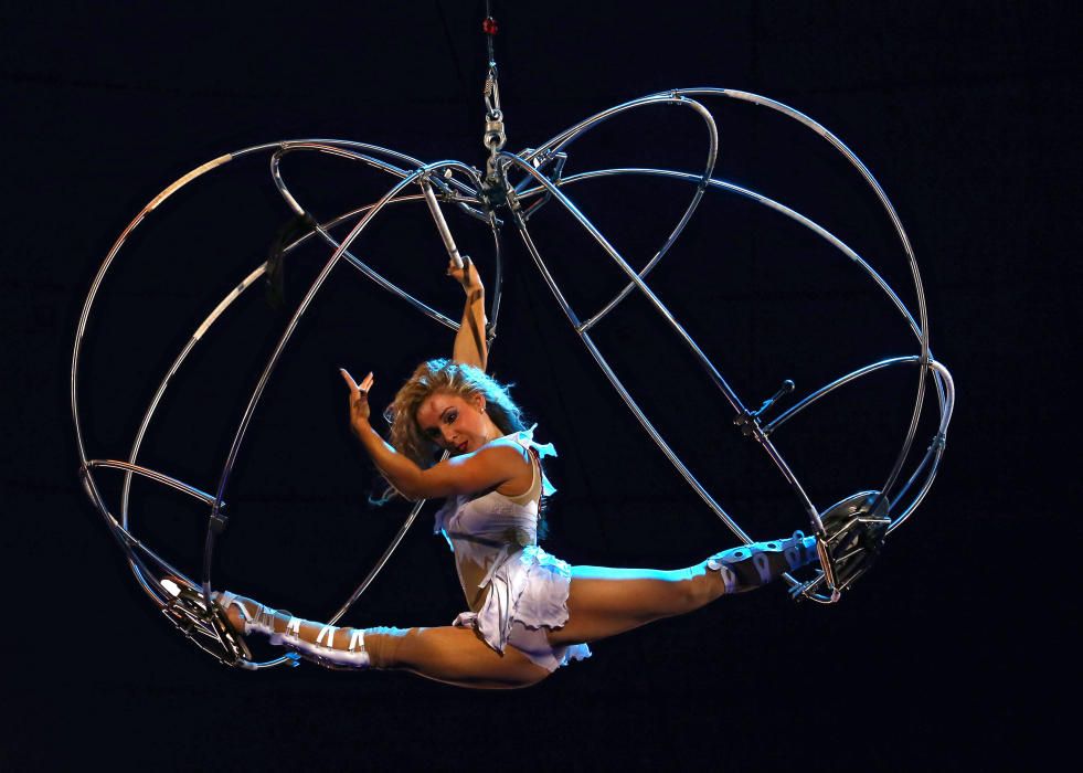 An acrobat performs during the presentation of ...