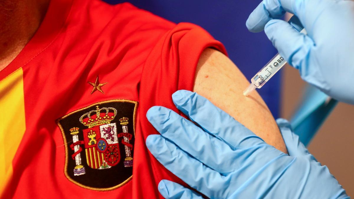 FILE PHOTO: Man receives his first dose of the AstraZeneca COVID-19 vaccine in Madrid