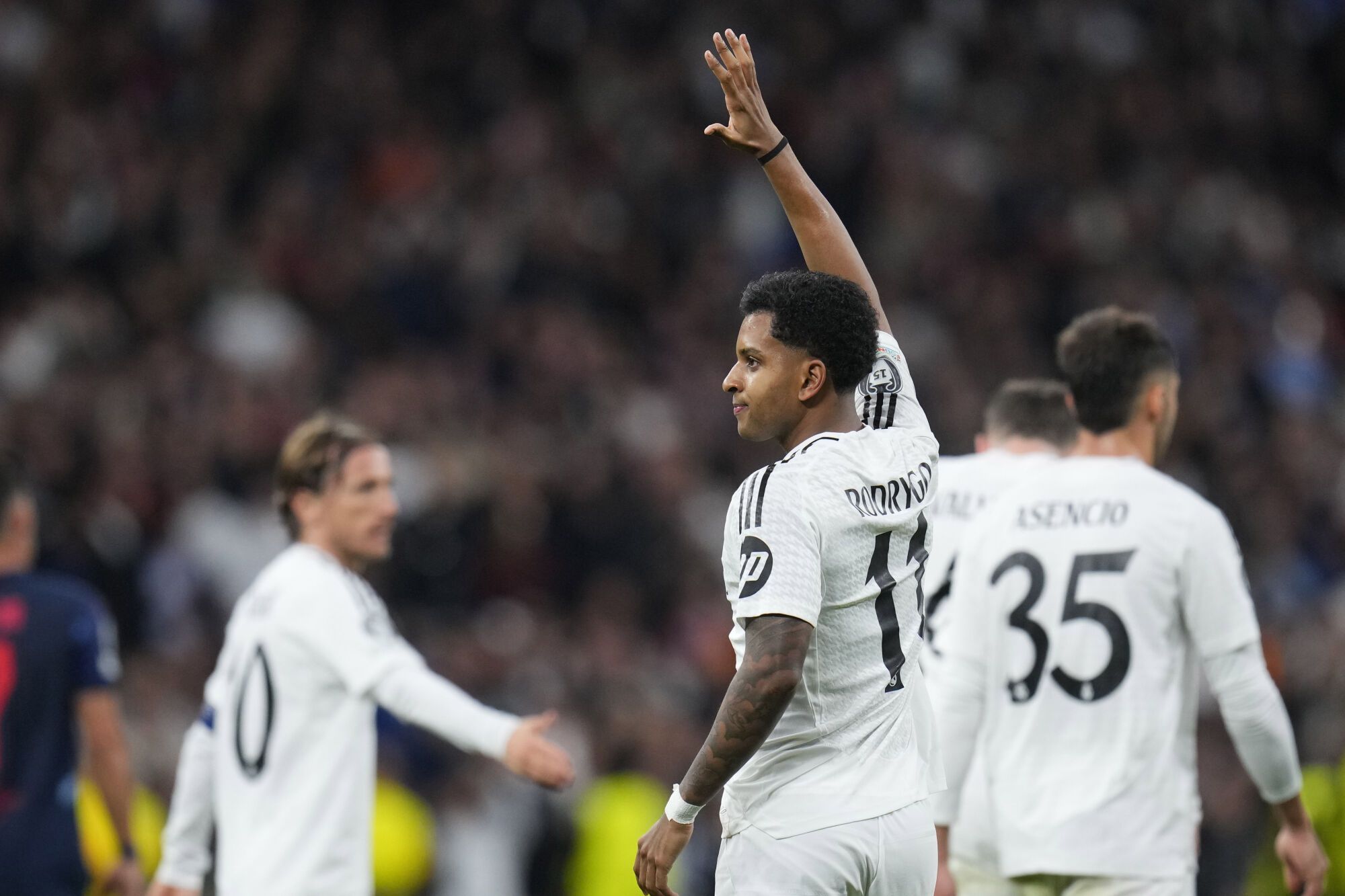 Real Madrid's Rodrygo, celebrates with his teammate Kylian Mbappe after scoring his side's 2nd goal during the Champions League opening phase soccer match between Real Madrid and FC Salzburg at the Santiago Bernabeu stadium in Madrid, Wednesday, Jan. 22, 2025. (AP Photo/Manu Fernandez). EDITORIAL USE ONLY/ONLY ITALY AND SPAIN