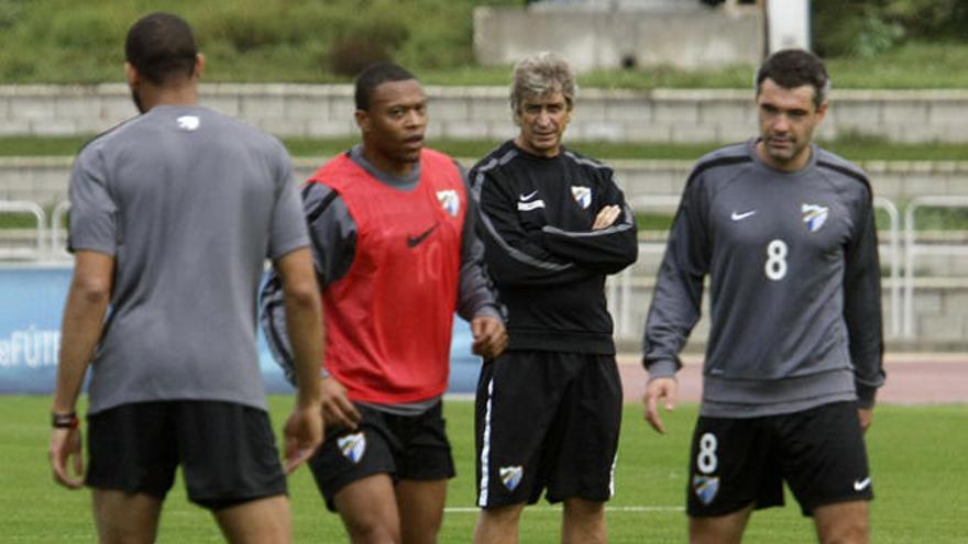 Baptista y Toulalan se ejercitaban a las órdenes de Manuel Pellegrini en un entrenamiento de este año 2012.