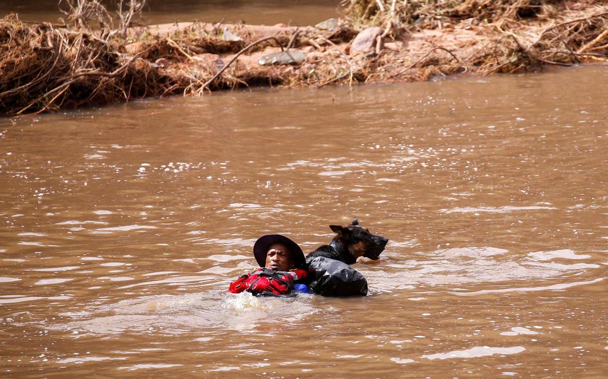 Search and rescue following torrential rains that triggered floods and mudslides, in Umbumbulu