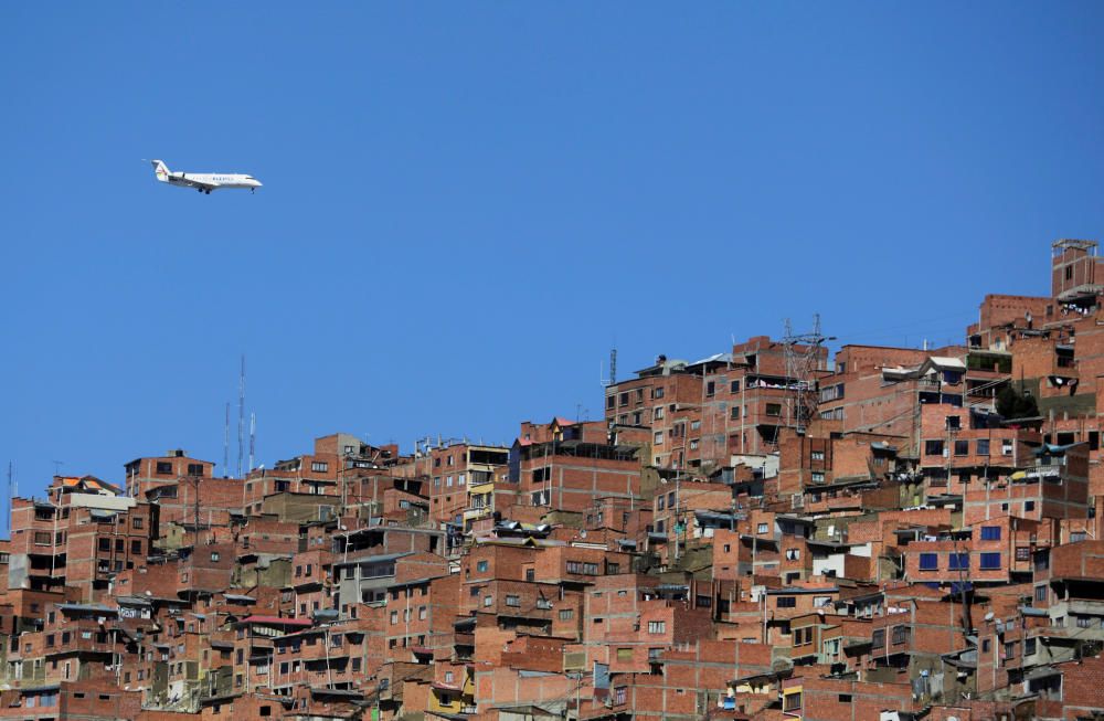 A plane is seen from Chua Uma, a neighbourhood ...