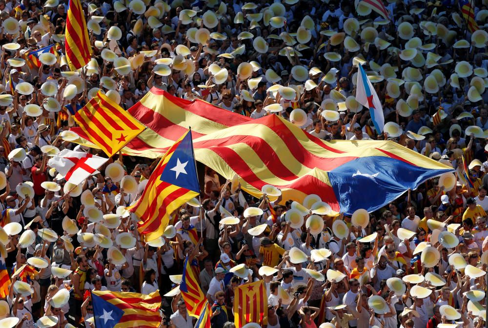 People hold Catalan separatist flags known as ...