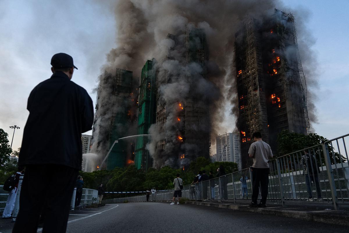 Smoke rises after a fire broke out at Wang Fuk Court, a residential estate in the Tai Po district of Hong Kongs New Territories on Wednesday, Nov. 26 2025. (AP Photo/Chan Long Hei)