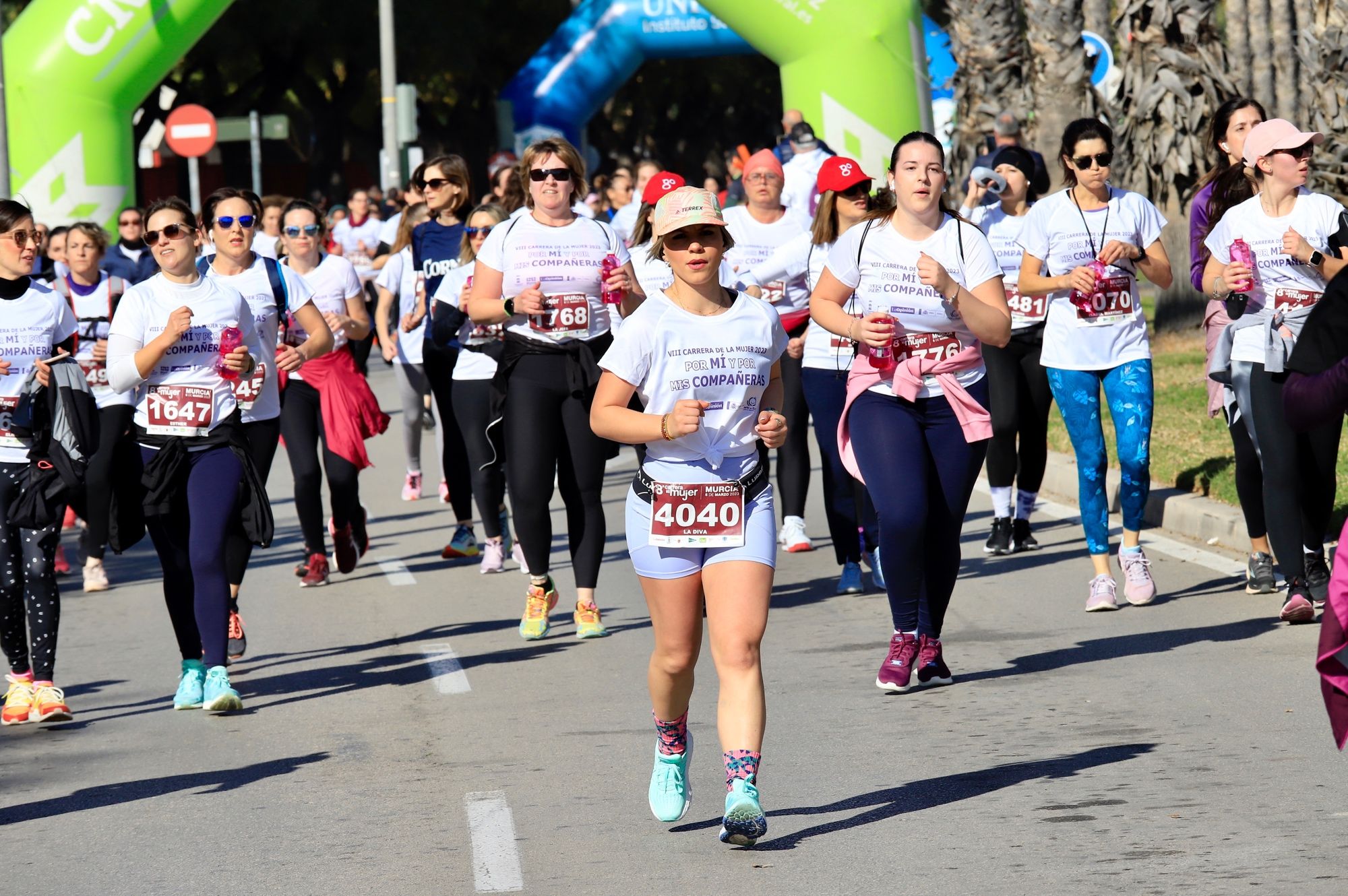 La salida y el recorrido de la Carrera de la Mujer 'inmortalizados' en imágenes