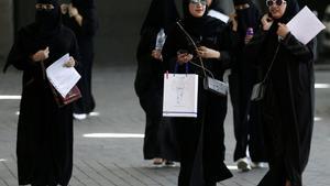 FILE PHOTO  Saudi students walk at the exhibition to guide job seekers at Glowork Women s Career Fair in Riyadh  Saudi Arabia October 2  2018  REUTERS Faisal Al Nasser File Photo