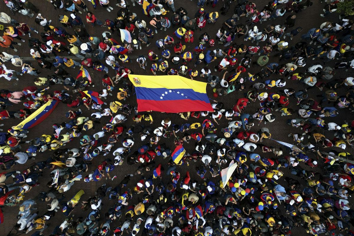 Opponents of Venezuelan President Nicolas Maduro protest the day before his inauguration for a third term in Bogota, Colombia, Thursday, Jan. 9, 2025. (AP Photo/Ivan Valencia)