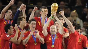 Spain’s midfielder Andres Iniesta holds the the FIFA World Cup tropfy after winning the 2010 World Cup football final by defeating The Netherlands during extra time at Soccer City stadium in Soweto, suburban Johannesburg on July 11, 2010. NO PUSH TO MOBILE / MOBILE USE SOLELY WITHIN EDITORIAL ARTICLE -   AFP PHOTO / JAVIER SORIANO