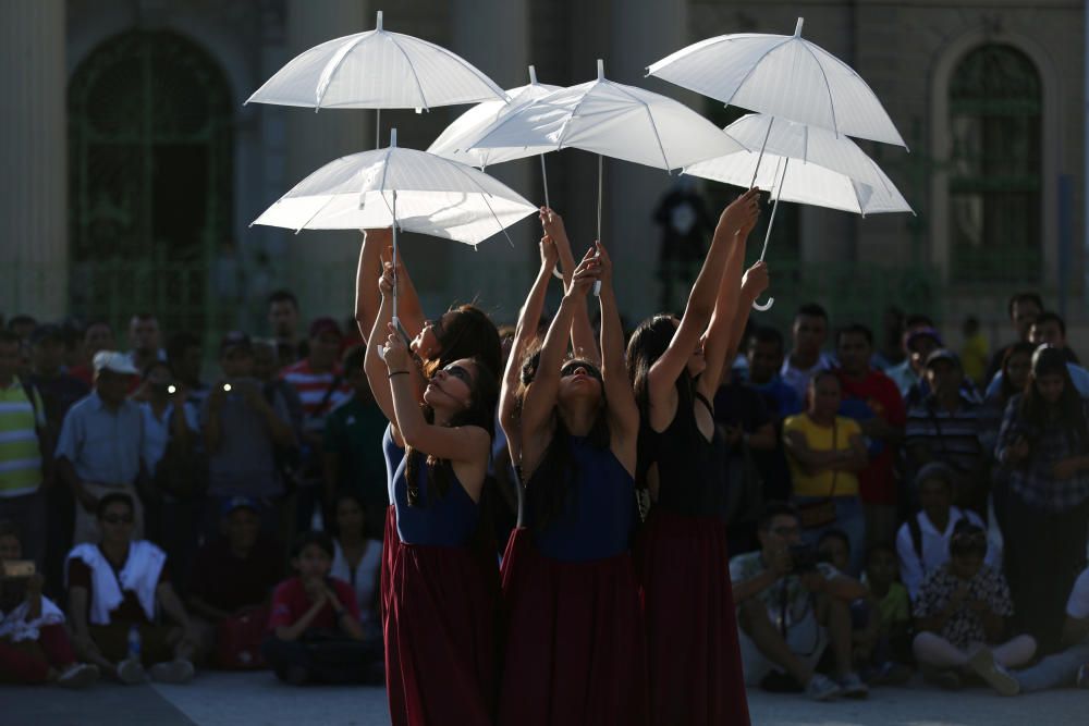 Dancers of the Humanum Tempore perform during ...