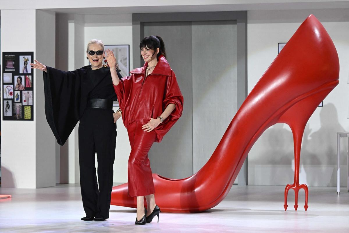 US actress Meryl Streep (L) and Anne Hathaway (R) react during a red carpet event to promote the film "The Devil Wears Prada 2" in Seoul on April 8, 2026. (Photo by Jung Yeon-je / AFP)