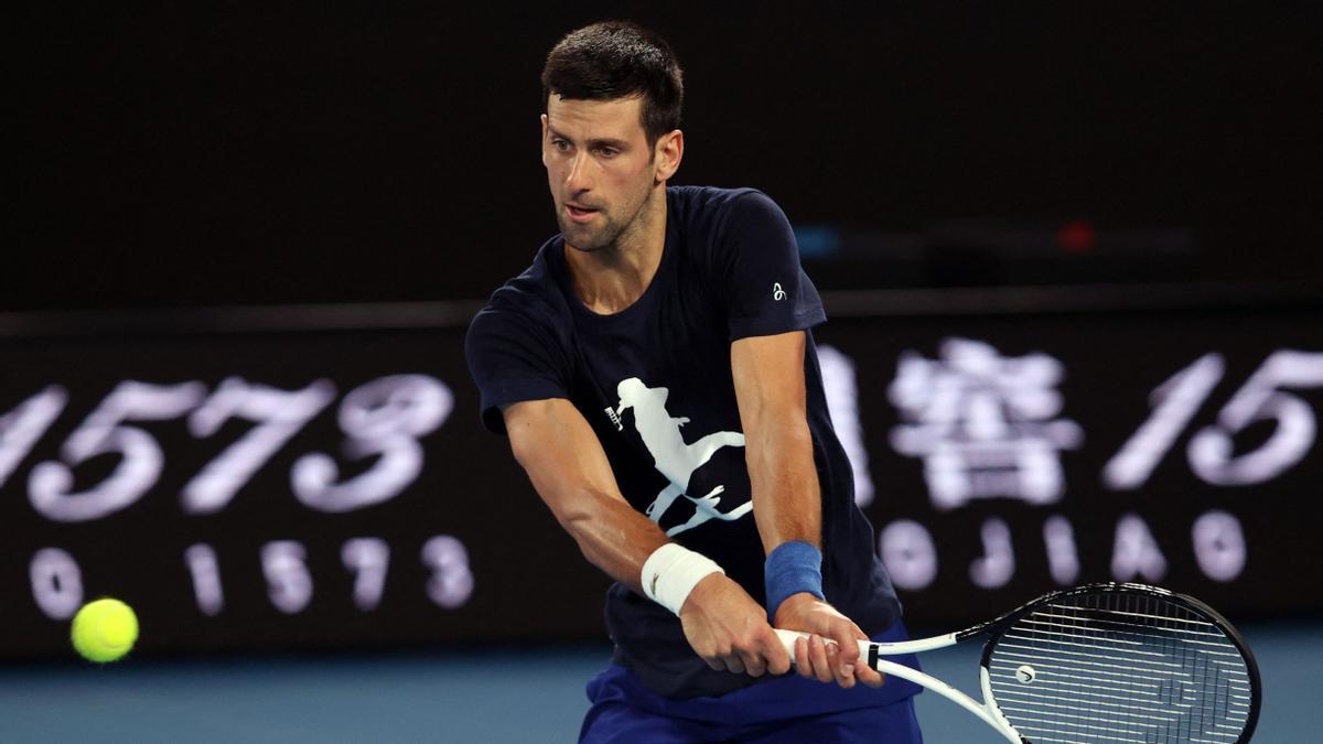 Novak Djokovic of Serbia attends a practice session ahead of the Australian Open tennis tournament in Melbourne on January 14, 2022. (Photo by MARTIN KEEP / AFP) / --IMAGE RESTRICTED TO EDITORIAL USE - NO COMMERCIAL USE--